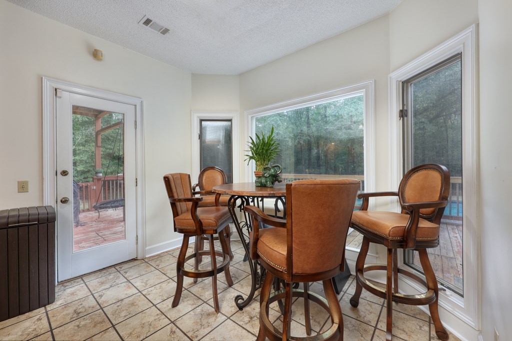 5135 Midland Trace Midland, GA 31820 - Photo 18 of 66 a view of a dining room with furniture window and outside view