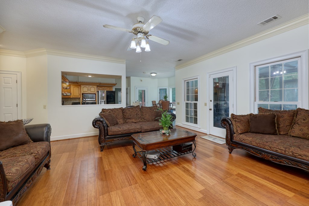 5135 Midland Trace Midland, GA 31820 - Photo 19 of 66 a living room with furniture and a wooden floor