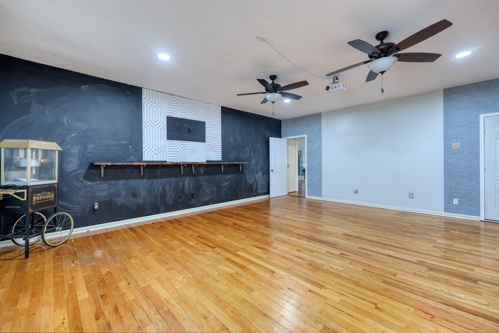 5135 Midland Trace Midland, GA 31820 - Photo 22 of 66 a view of a livingroom with a piano and wooden floor