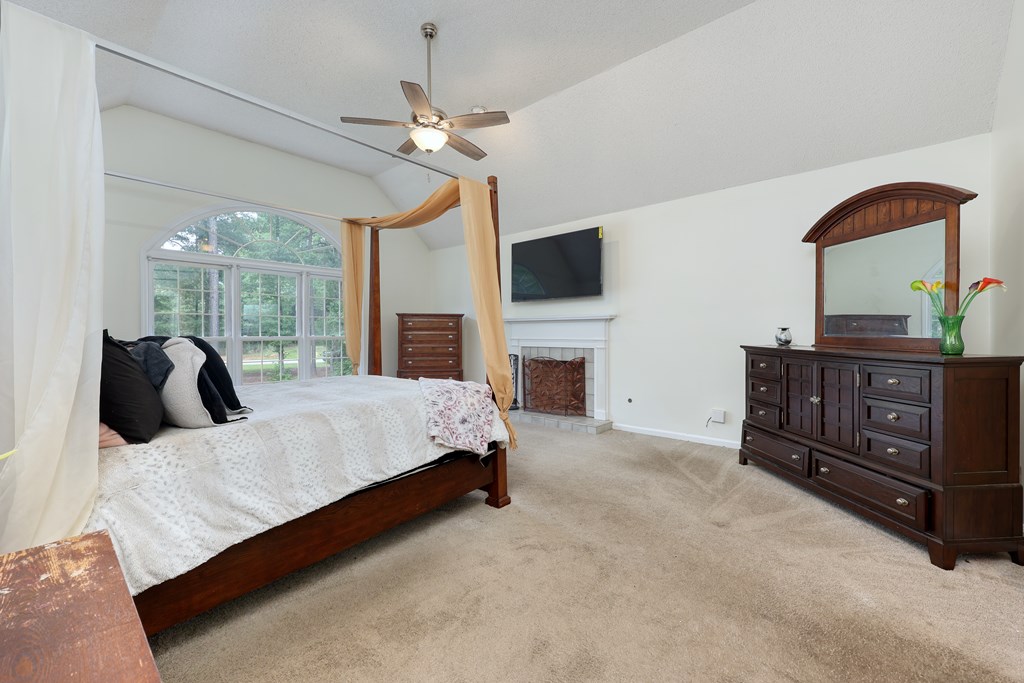 5135 Midland Trace Midland, GA 31820 - Photo 25 of 66 a bed room with a bed and a television