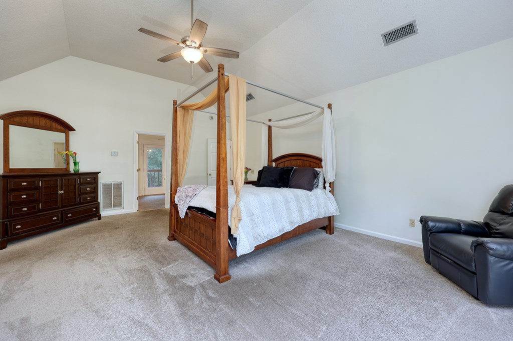 5135 Midland Trace Midland, GA 31820 - Photo 27 of 66 a bedroom with a bed and a ceiling fan