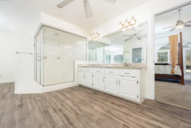 a bathroom with a sink a mirror and a mirror