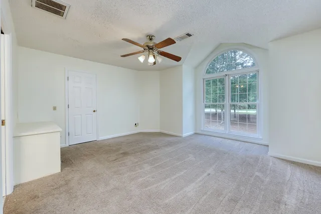 a bathroom with a toilet and a bathtub