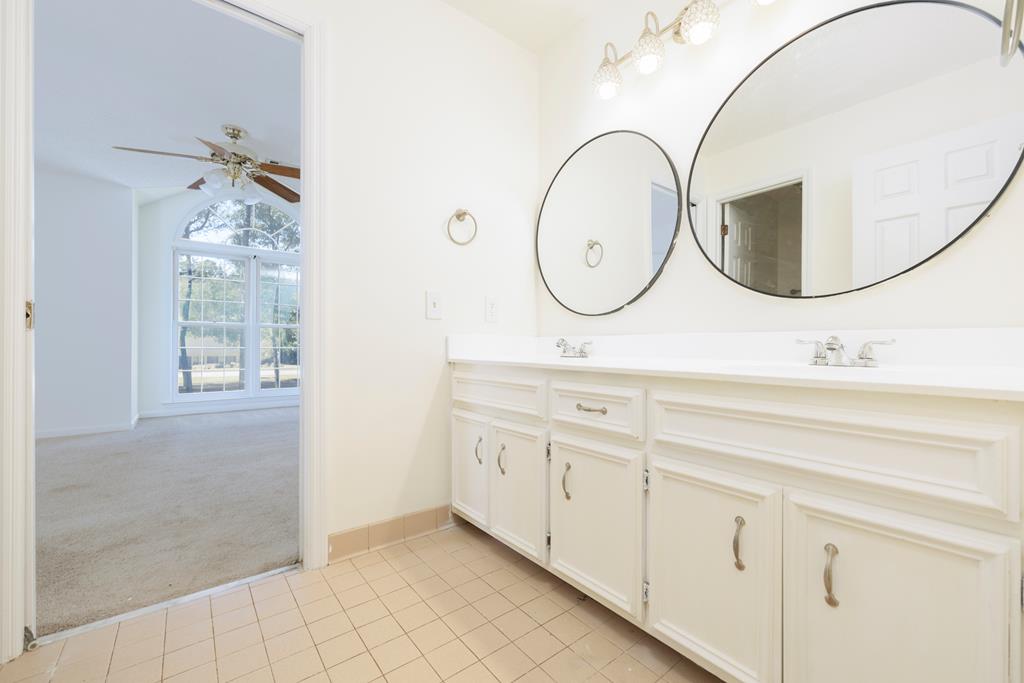 5135 Midland Trace Midland, GA 31820 - Photo 32 of 66 a bathroom with a double vanity sink mirror and a