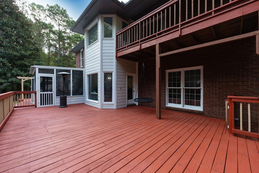 5135 Midland Trace Midland, GA 31820 - Photo 40 of 66 a view of a house with wooden deck