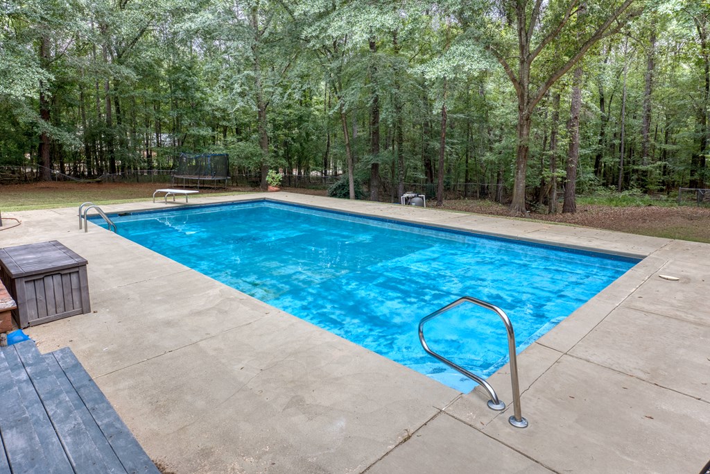 5135 Midland Trace Midland, GA 31820 - Photo 45 of 66 a view of a swimming pool with trees