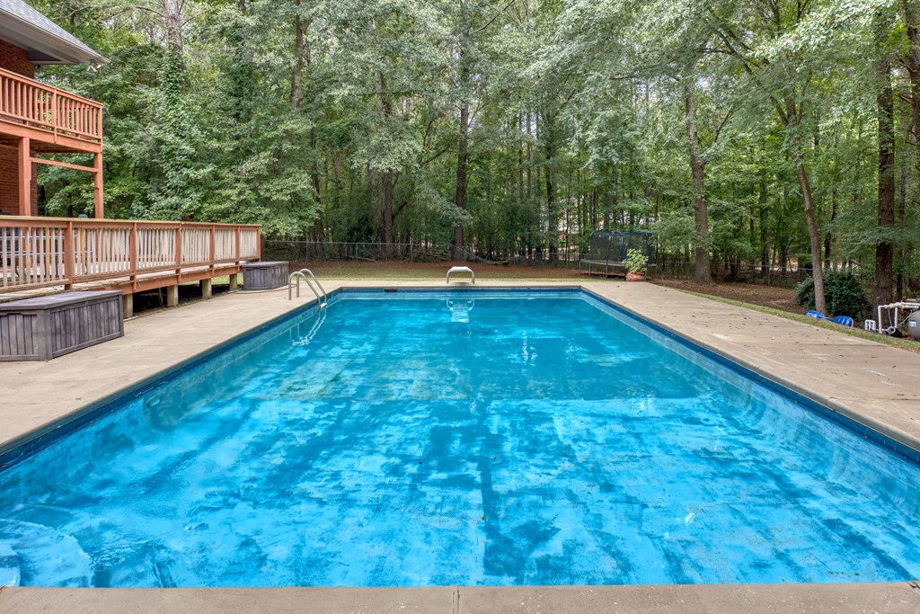 5135 Midland Trace Midland, GA 31820 - Photo 47 of 66 a view of a swimming pool with a patio