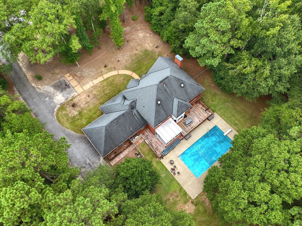 5135 Midland Trace Midland, GA 31820 - Photo 54 of 66 an aerial view of a house with a garden and swimming pool