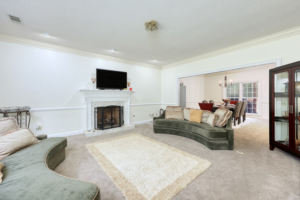 5135 Midland Trace Midland, GA 31820 - Photo 7 of 66 a living room with furniture and a fireplace