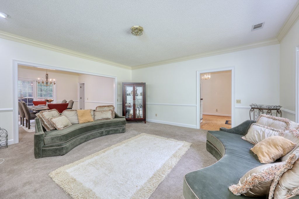 5135 Midland Trace Midland, GA 31820 - Photo 8 of 66 a bedroom with furniture and a couch