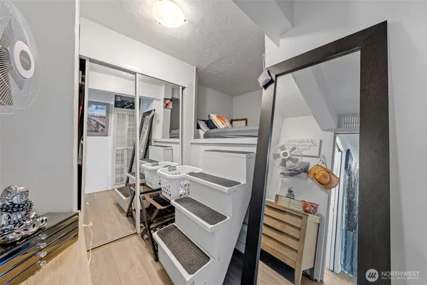 a bathroom with a toilet a sink and mirror