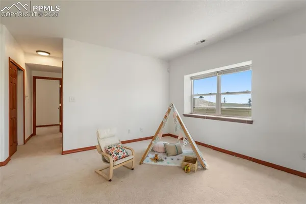 a living room with a bed and a couch