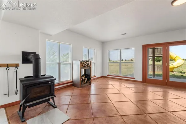 a view of a livingroom with furniture and a window