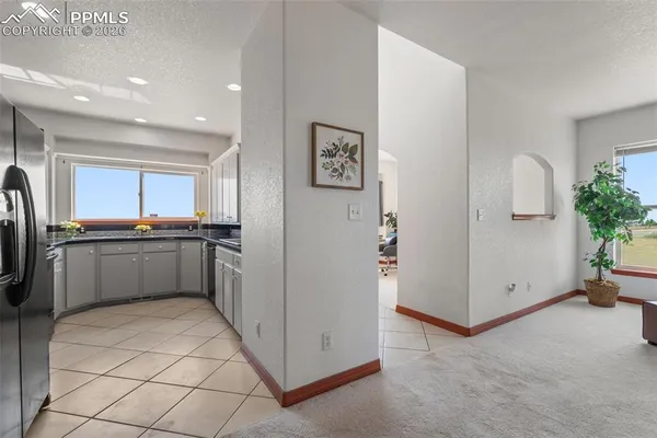 a kitchen with stainless steel appliances a refrigerator and a sink