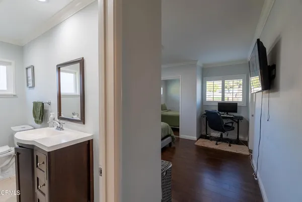 a en suite bathroom with a sink double vanity and a mirror
