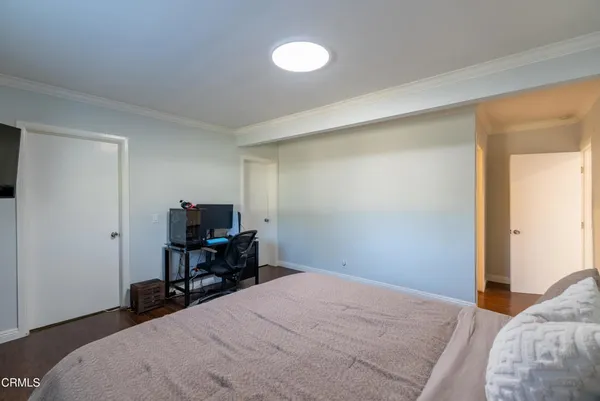 a bedroom with a bed and a chair