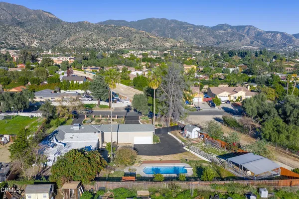 an aerial view of residential houses and outdoor space