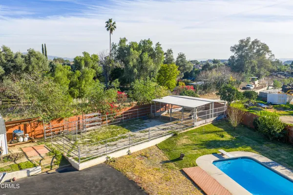 a view of a swimming pool with a patio