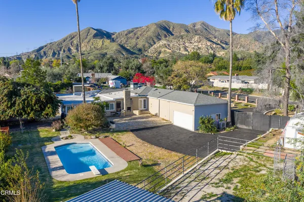 a view of a swimming pool with a patio