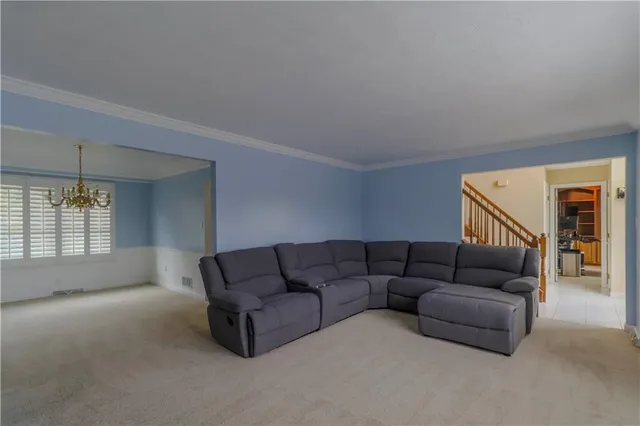 a view of balcony with furniture and large windows