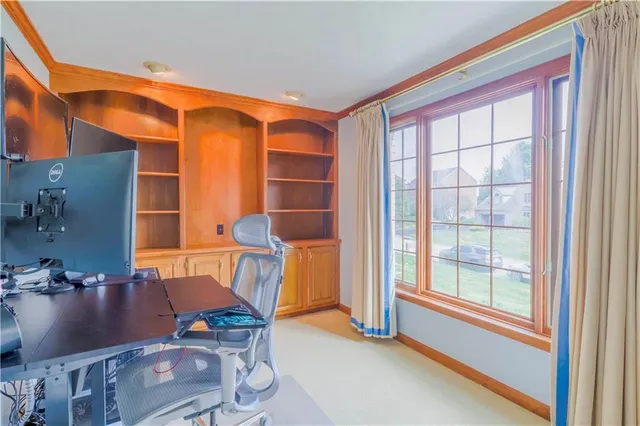 a view of a workspace with furniture