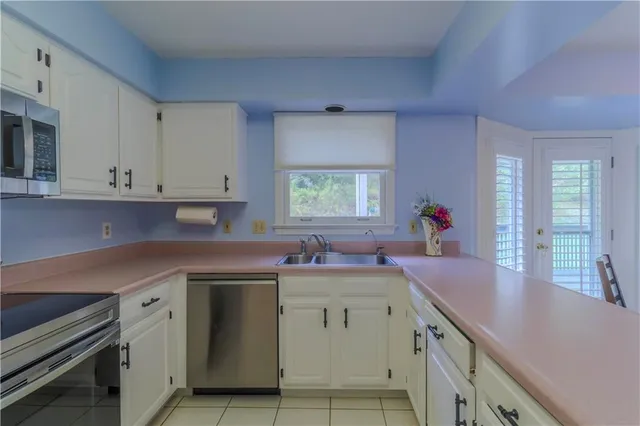 a kitchen with a sink and cabinets