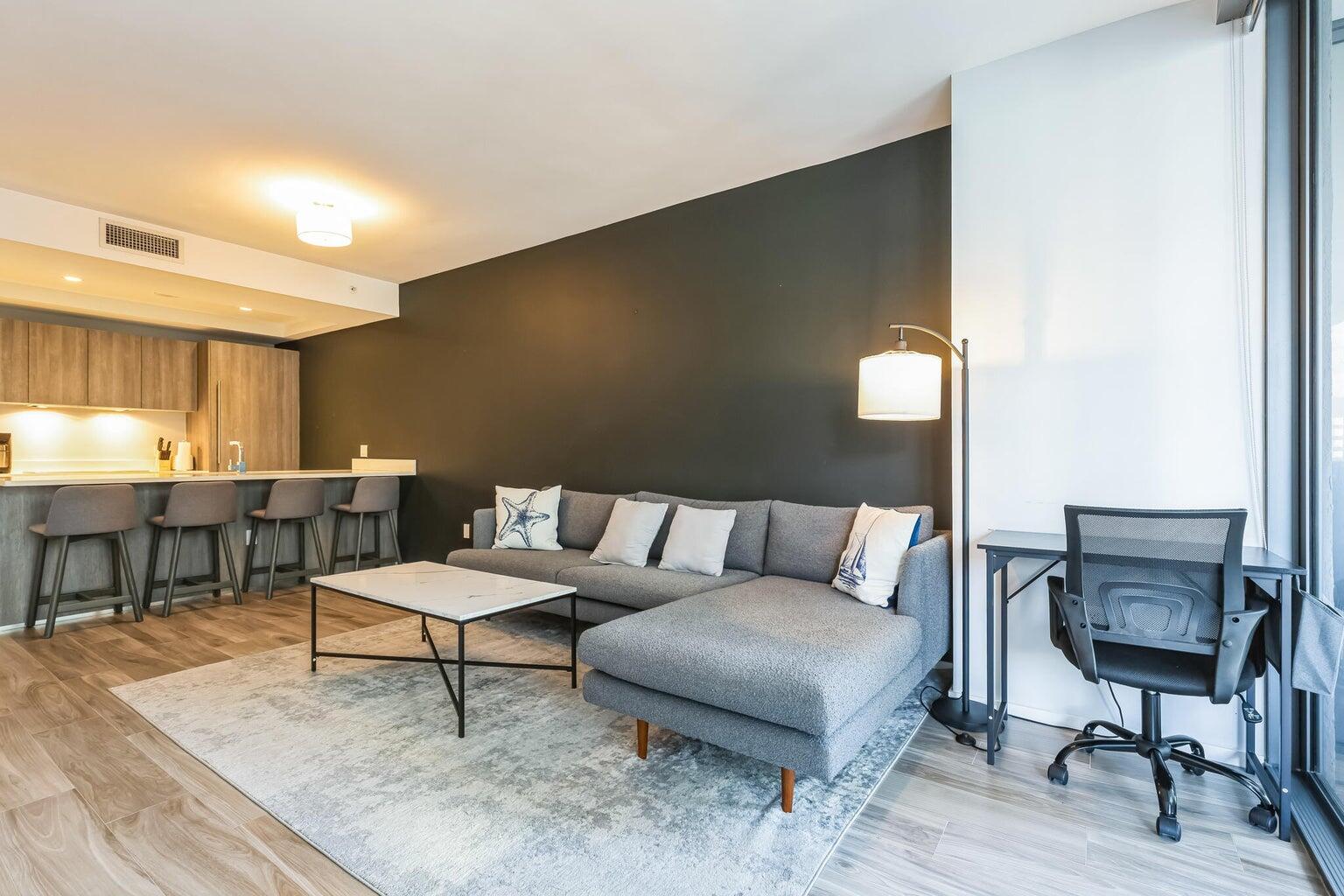 801 South Miami Avenue, Unit 3607 Miami, FL 33131 - Photo 14 of 38 a living room with furniture and a table