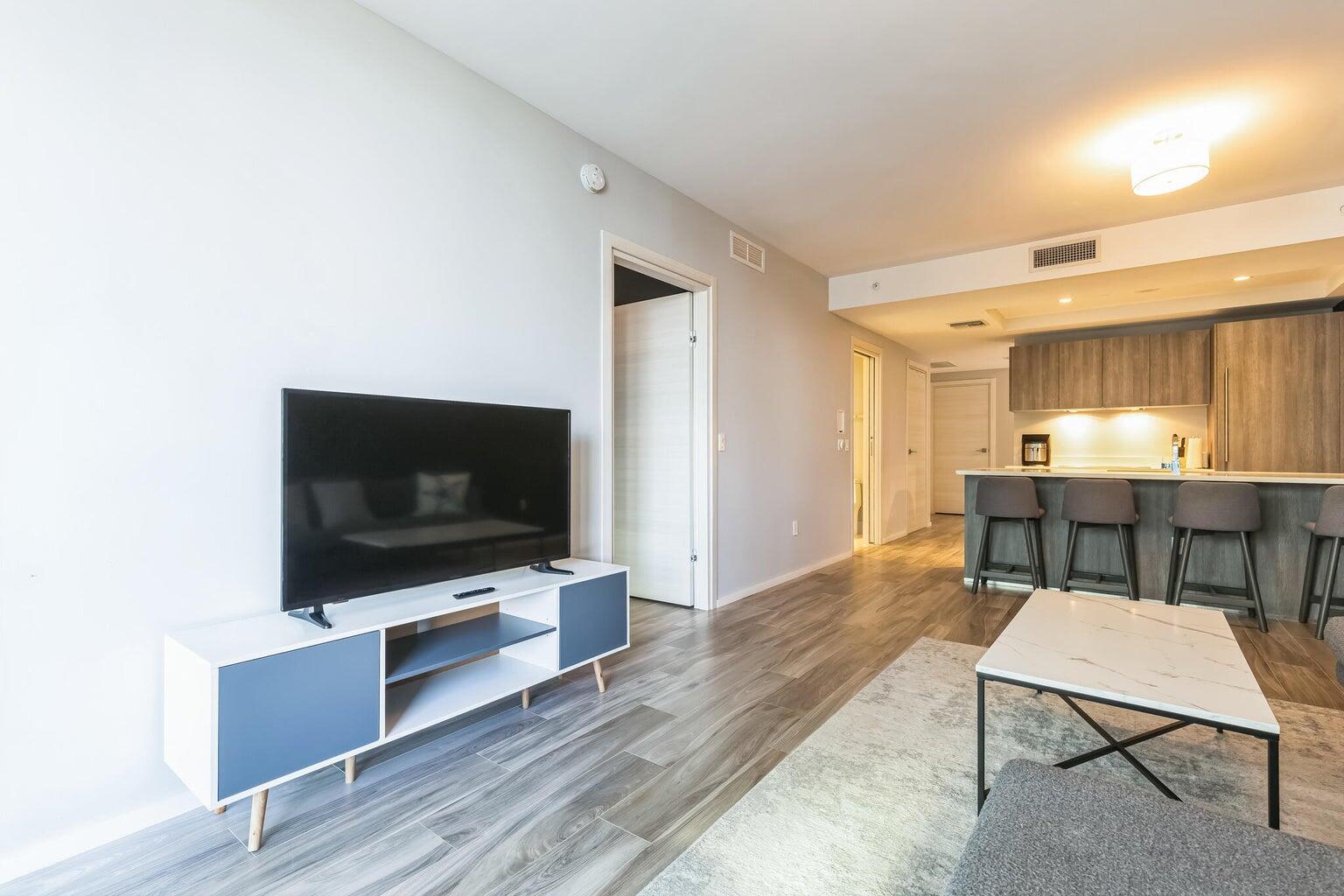 801 South Miami Avenue, Unit 3607 Miami, FL 33131 - Photo 16 of 38 a living room with furniture and a flat screen tv