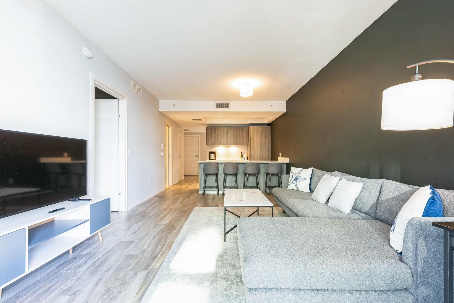 801 South Miami Avenue, Unit 3607 Miami, FL 33131 - Photo 17 of 38 a living room with furniture and a flat screen tv