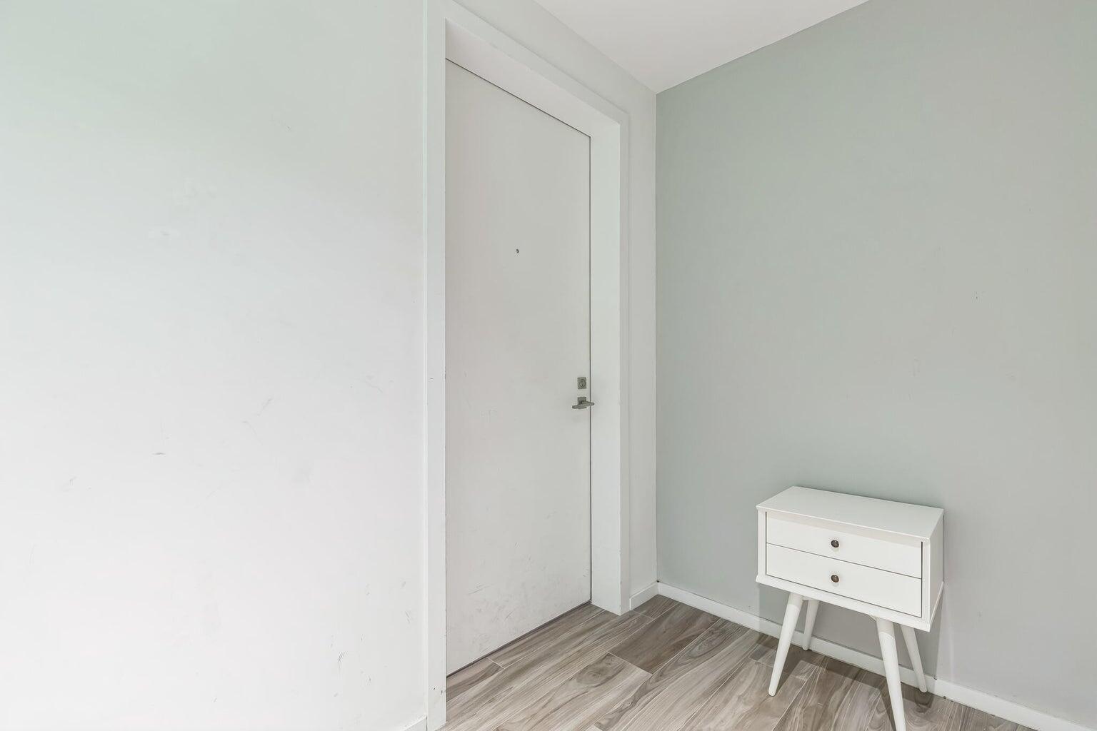 801 South Miami Avenue, Unit 3607 Miami, FL 33131 - Photo 19 of 38 a room with a window and wooden floor