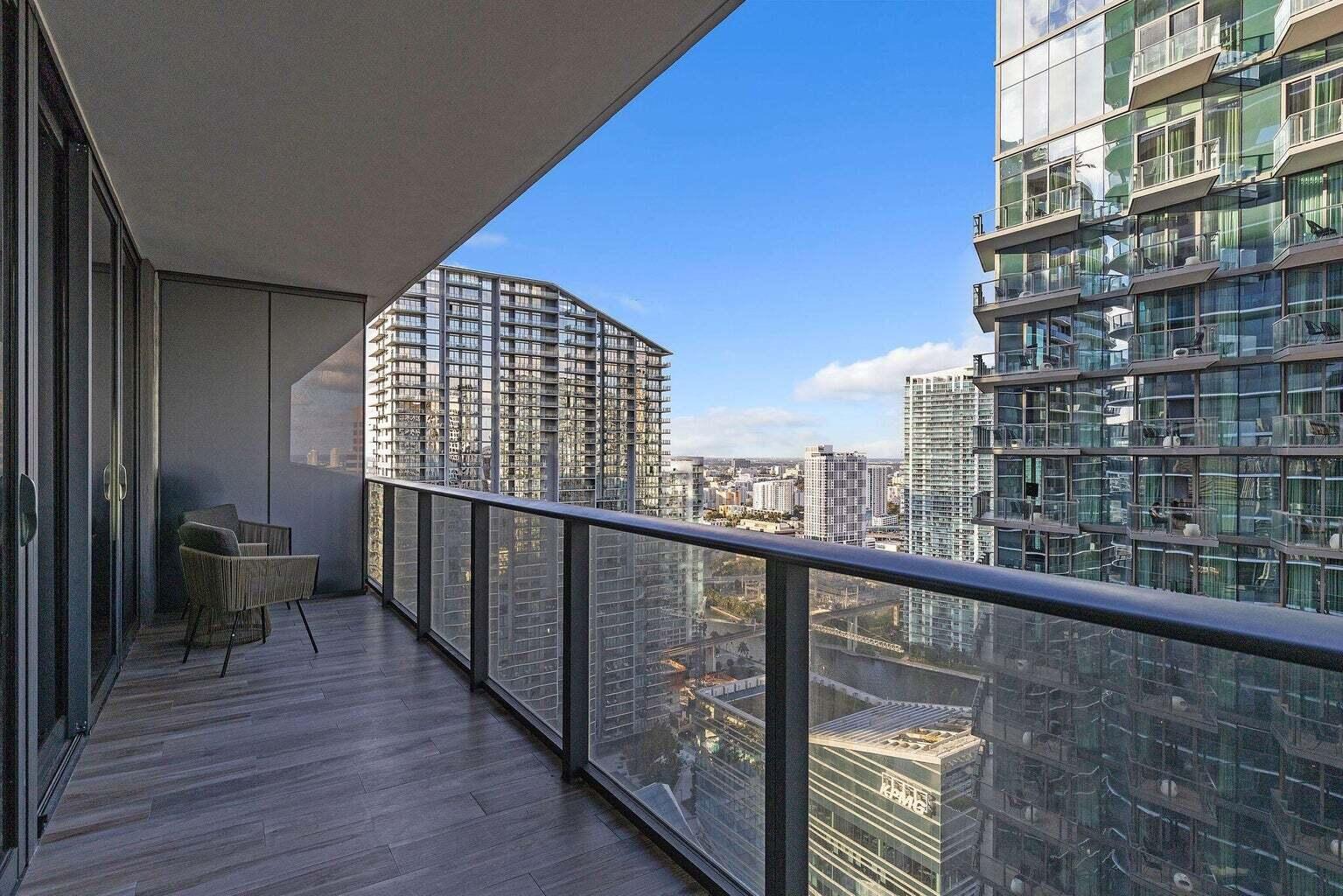 801 South Miami Avenue, Unit 3607 Miami, FL 33131 - Photo 2 of 38 a view of city from a balcony