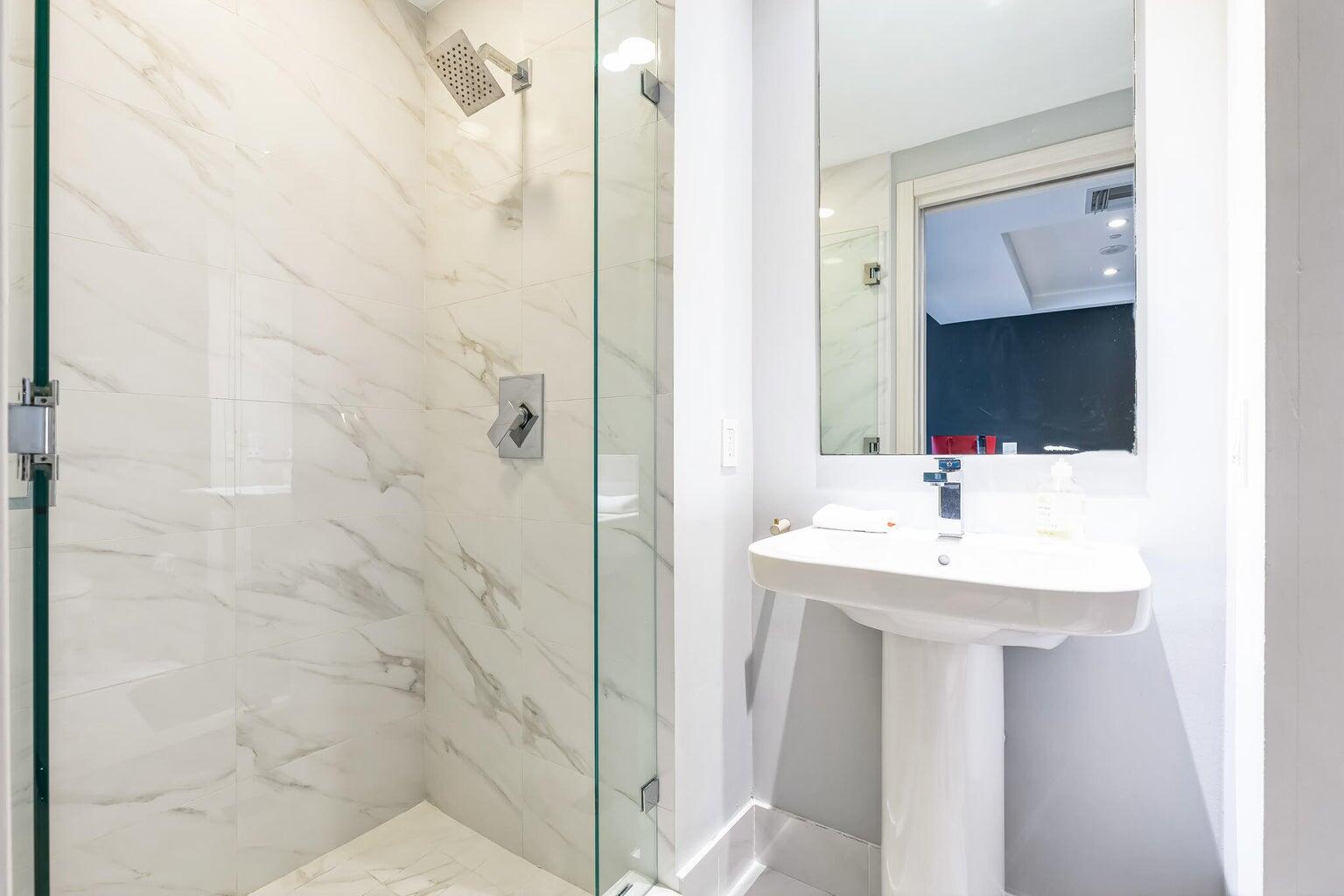 801 South Miami Avenue, Unit 3607 Miami, FL 33131 - Photo 23 of 38 a bathroom with a sink and a mirror