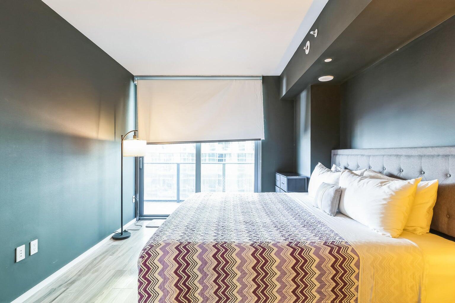 801 South Miami Avenue, Unit 3607 Miami, FL 33131 - Photo 31 of 38 a bedroom with a bed and a window