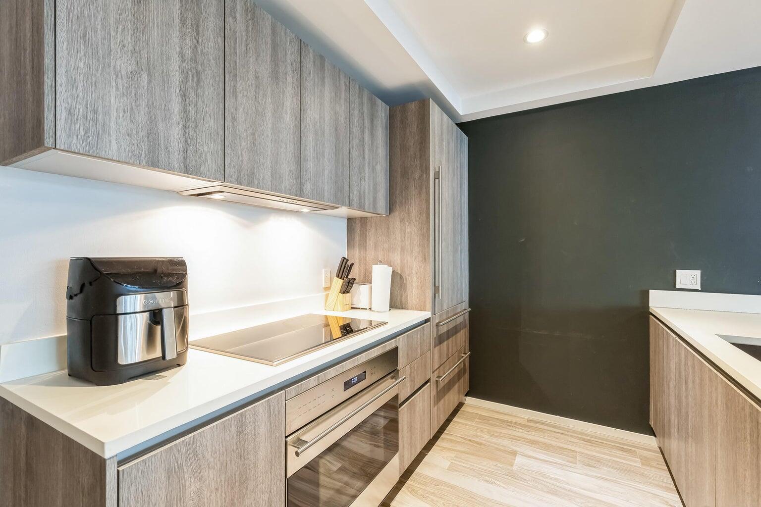 801 South Miami Avenue, Unit 3607 Miami, FL 33131 - Photo 37 of 38 a kitchen with a sink and cabinets