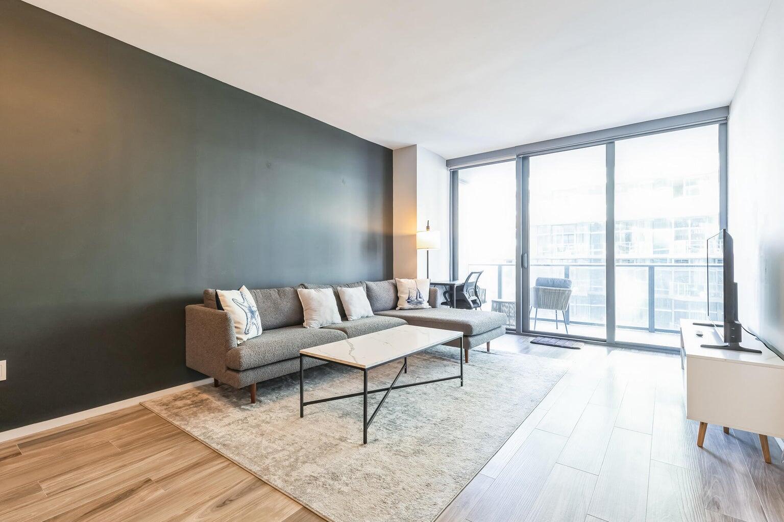 801 South Miami Avenue, Unit 3607 Miami, FL 33131 - Photo 6 of 38 a living room with furniture and a large window with outer view