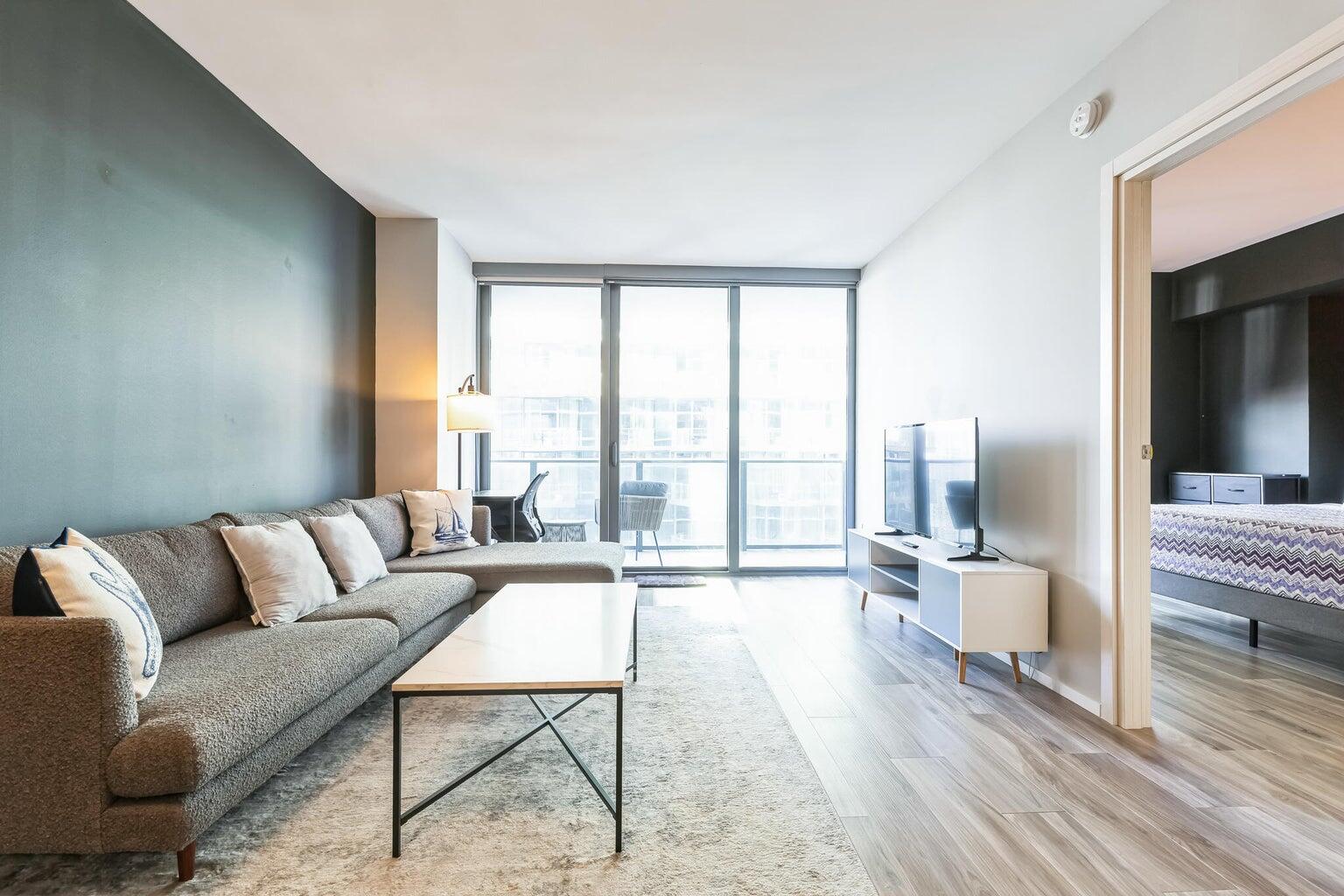 801 South Miami Avenue, Unit 3607 Miami, FL 33131 - Photo 7 of 38 a living room with furniture and a large window