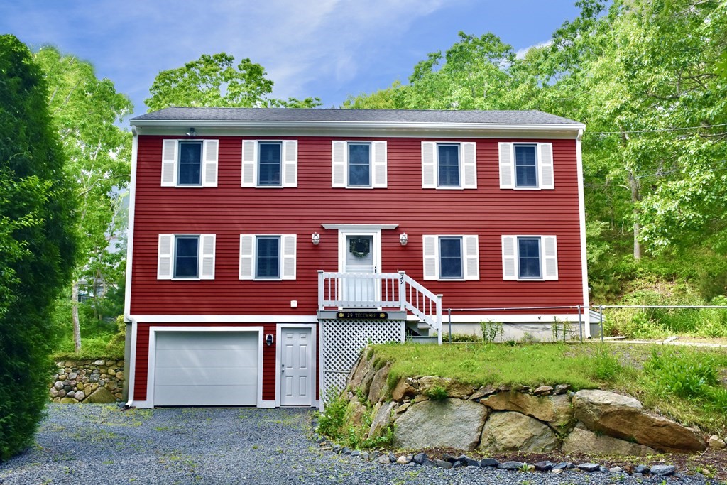 29 Tecumseh Road Bourne, MA 02562 - Photo 1 of 28 a front view of a house with a yard and outdoor seating