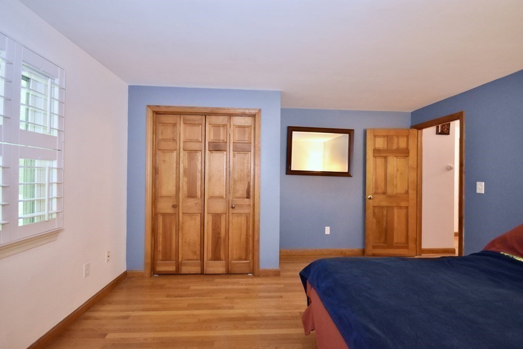 29 Tecumseh Road Bourne, MA 02562 - Photo 19 of 28 a bedroom with a bed and a window