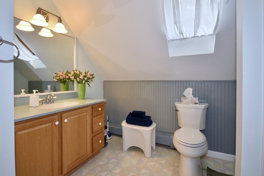 29 Tecumseh Road Bourne, MA 02562 - Photo 22 of 28 a bathroom with a toilet sink and mirror
