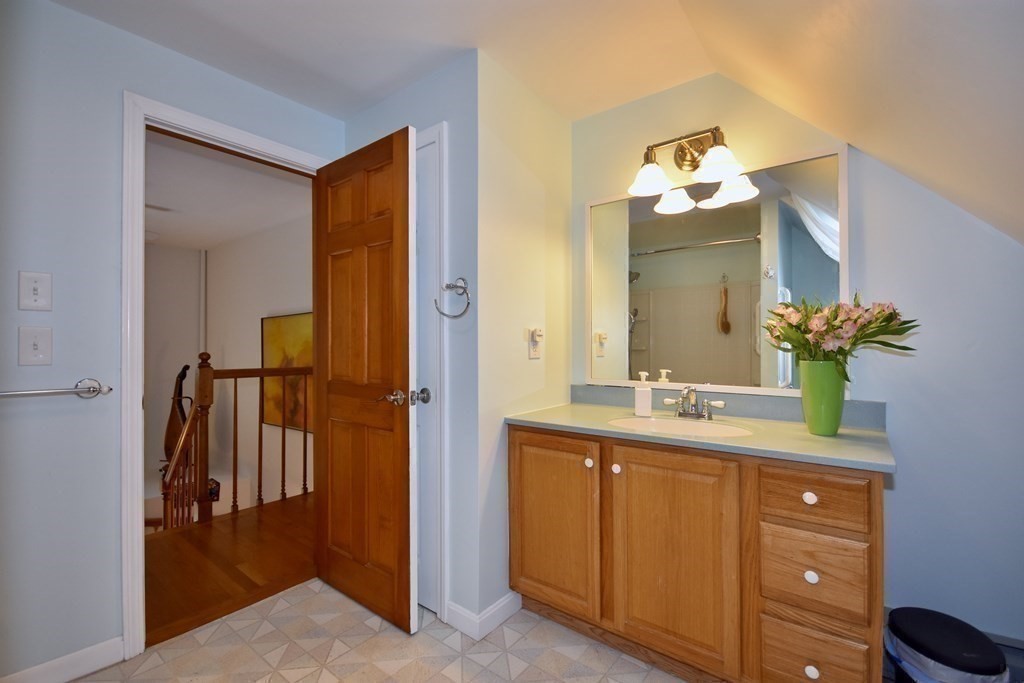 29 Tecumseh Road Bourne, MA 02562 - Photo 23 of 28 a bathroom with a sink and a mirror