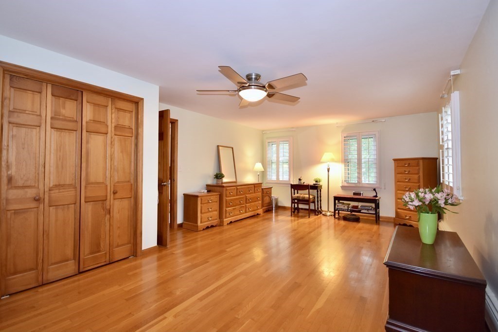 29 Tecumseh Road Bourne, MA 02562 - Photo 26 of 28 a living room with furniture gym equipment and a large window