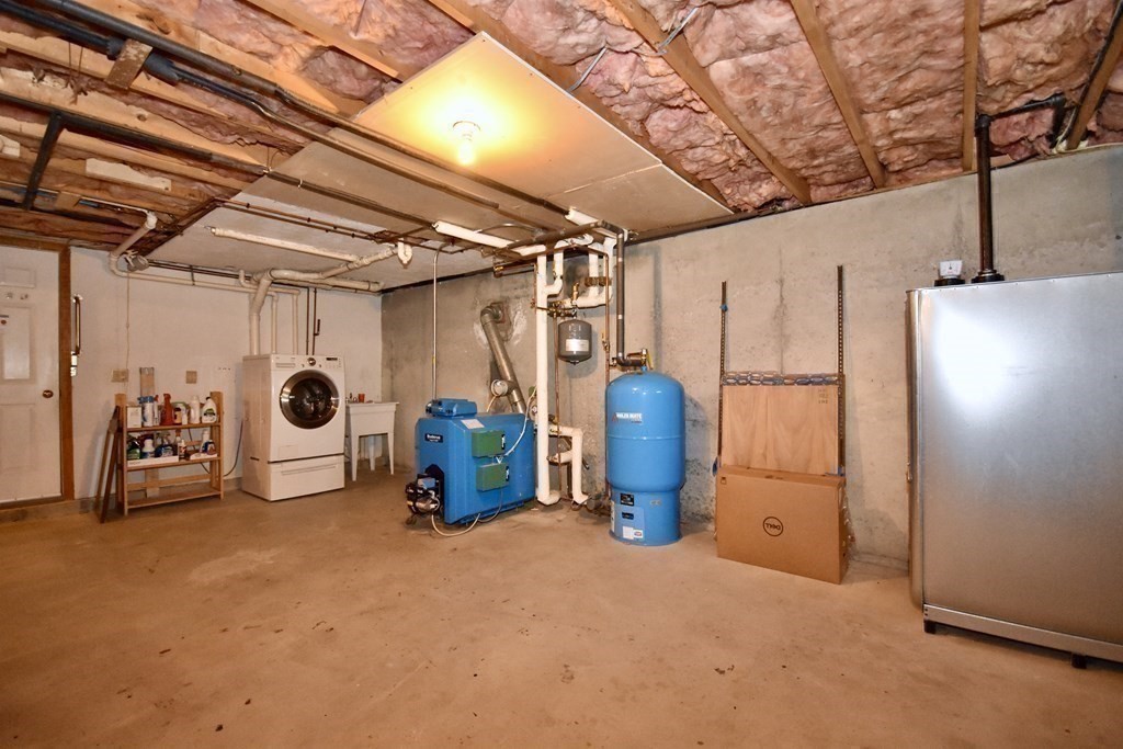 29 Tecumseh Road Bourne, MA 02562 - Photo 28 of 28 a view of a garage room with gym equipment