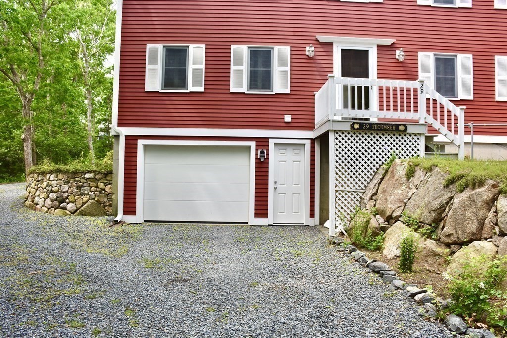 29 Tecumseh Road Bourne, MA 02562 - Photo 3 of 28 a front view of a house with a garden