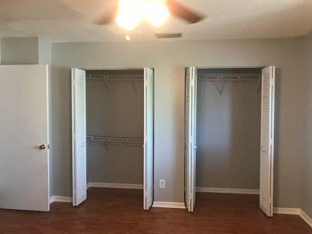 an empty room with closet area