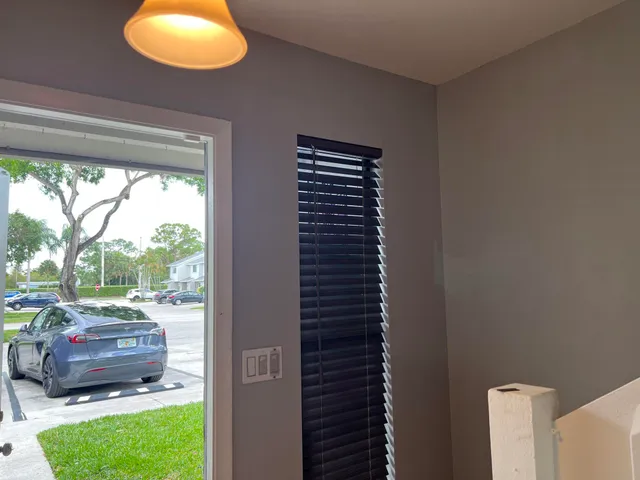 a bathroom with a granite countertop toilet and a sink