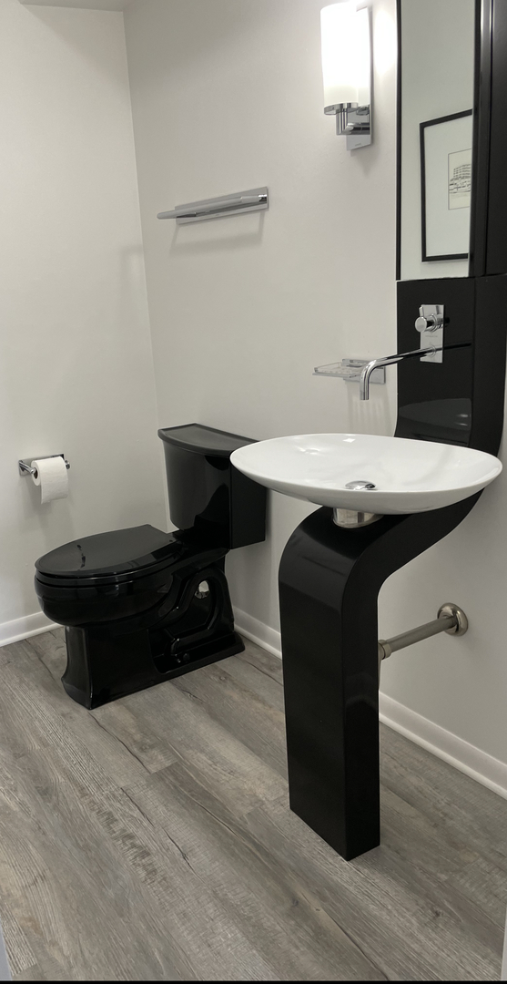 1958 McCraren Road Highland Park, IL 60035 - Photo 13 of 23 a room with a sink and a mirror