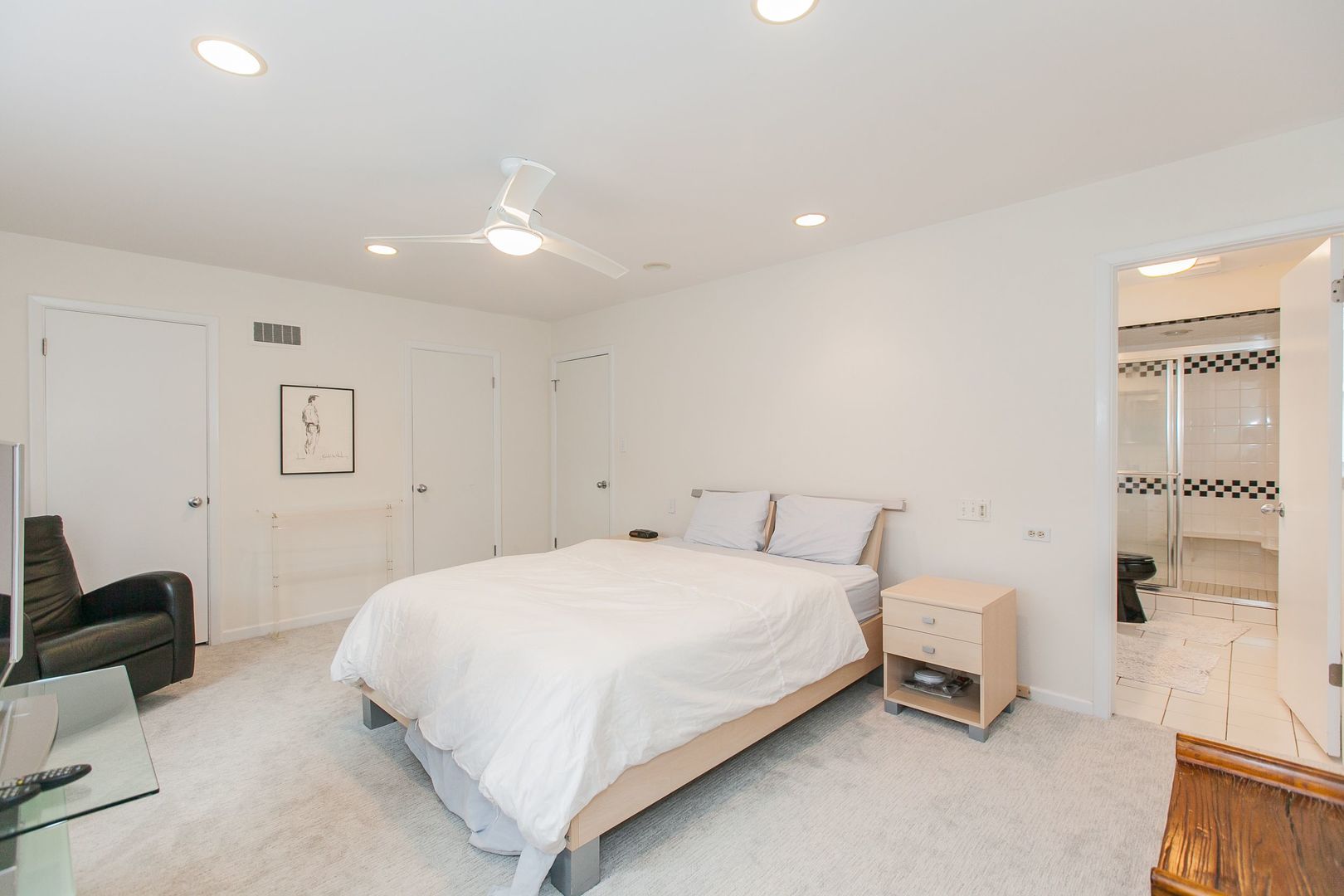 1958 McCraren Road Highland Park, IL 60035 - Photo 16 of 23 a bedroom with a bed and a lamp with wooden floor