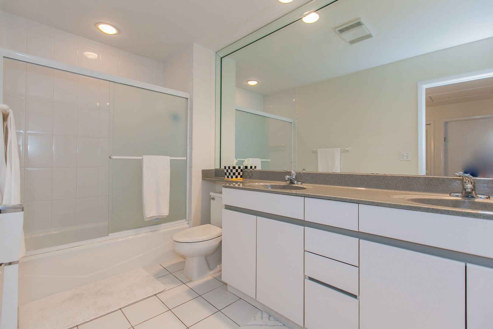 1958 McCraren Road Highland Park, IL 60035 - Photo 18 of 23 a bathroom with a double vanity sink and a toilet