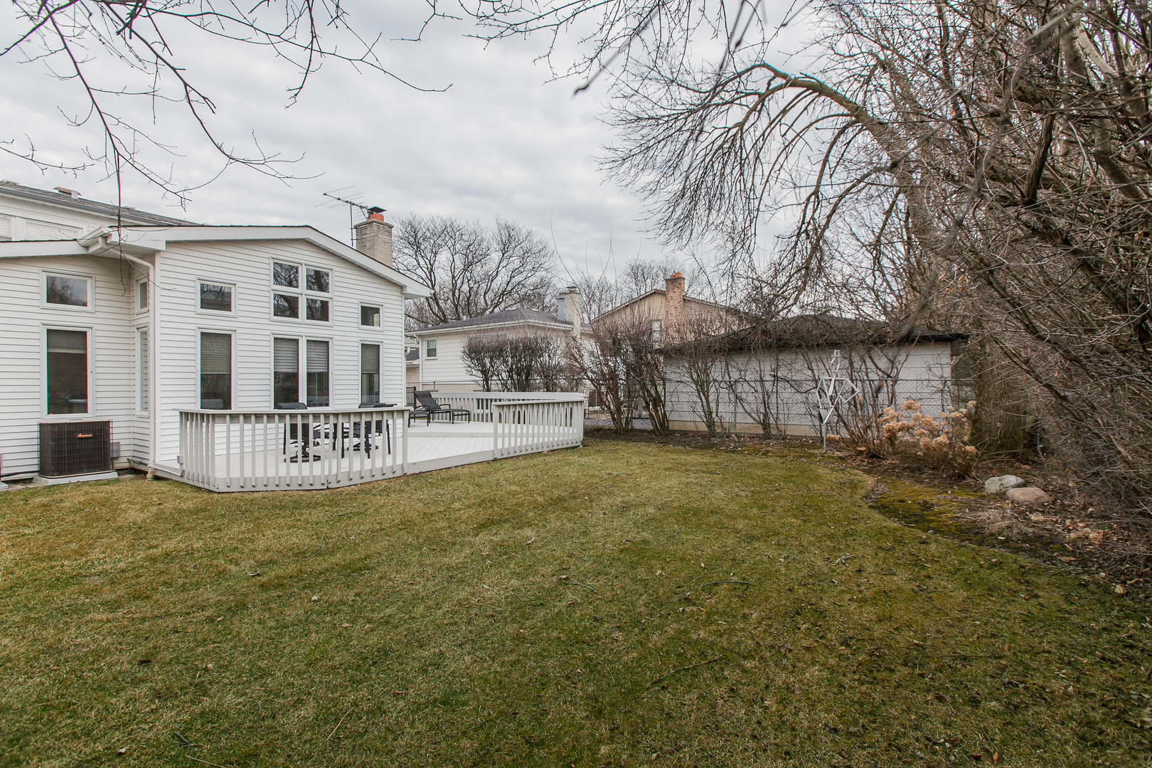 1958 McCraren Road Highland Park, IL 60035 - Photo 2 of 23 a view of residential houses with yard and wooden fence