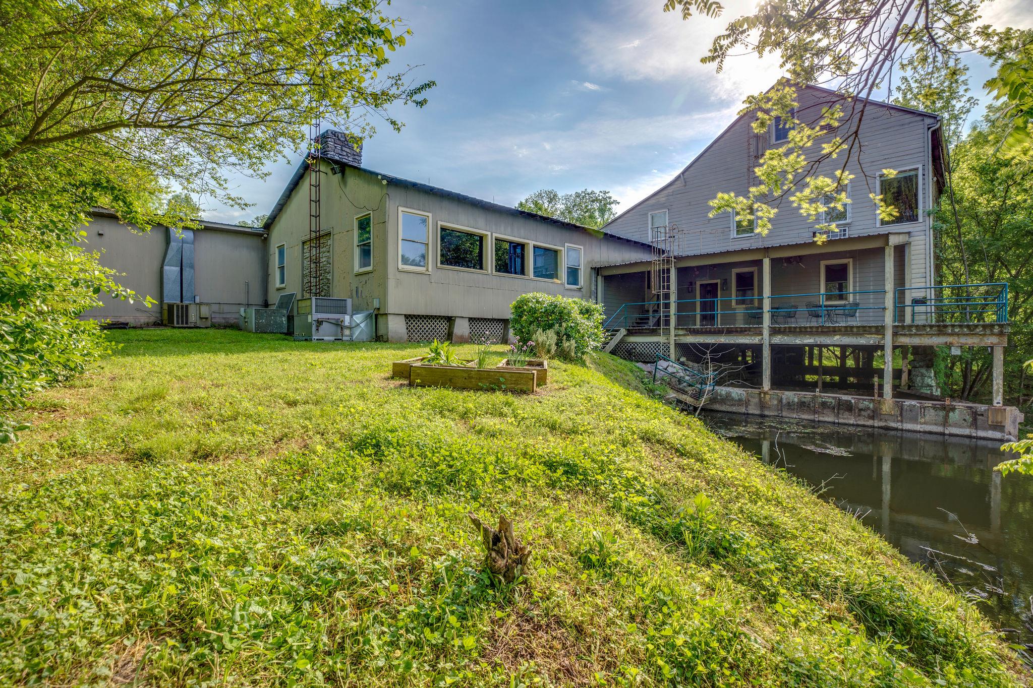 200 Cortner Mill Road Normandy, TN 37360 - Photo 11 of 30 a backyard of a house with yard table and chairs